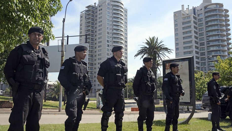 Security forces stand guard near Montevideo's World Trade Centre, which houses offices of the Israeli embassy, where a suspicious package was found by the K9 unit during a routine inspection on January 8, 2015. The artifact, which simulated an improvised explosive device, was defused by the Explosives Brigade, who suspect it was put to test the police response time. AFP PHOTO / Mario GOLDMAN (Photo credit should read MARIO GOLDMAN/AFP/Getty Images)