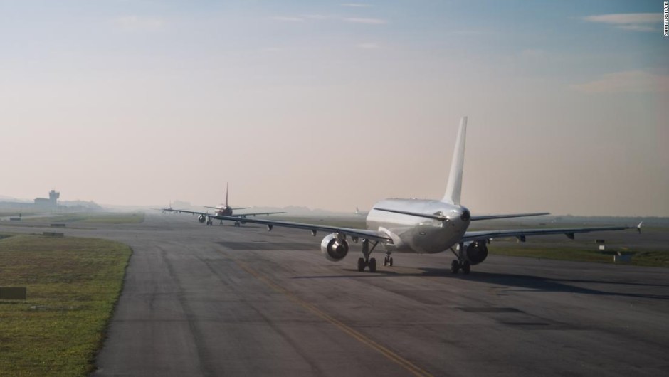 Commercial airplane queue and taxiing on tarmac to take off on runway on a morning ; Shutterstock ID 577160230; Job: -