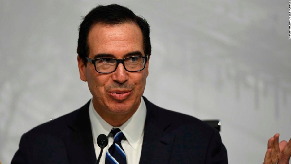 US Secretary of the Treasury Steven Mnuchin, gestures during a press conference in Buenos Aires, on July 22, 2018, at the end of the G20 Finance Ministers and Central Bank Governors meeting. - Group of 20 finance ministers warned on Sunday that "heightened trade and geopolitical tensions" posed risks to global economic growth as two days of meetings came to a close. (Photo by EITAN ABRAMOVICH / AFP) (Photo credit should read EITAN ABRAMOVICH/AFP/Getty Images)