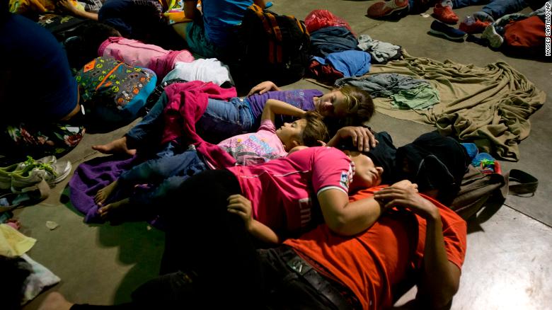 Honduran migrants sleep at an improvised shelter in Esquipulas, Guatemala, Monday, Oct. 15, 2018. The group, estimated at 1,600 to 2,000 people hoping to reach the United States, bedded down for the night in this town after Guatemala's authorities blinked first in attempts to halt their advance. (AP Photo/Moises Castillo)