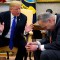 U.S. President Donald Trump speaks with Senate Democratic Leader Chuck Schumer (D-NY) in the Oval Office of the White House in Washington, U.S., December 11, 2018. REUTERS/Kevin Lamarque
