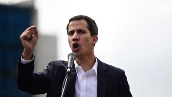 Venezuela's National Assembly head Juan Guaido speaks to the crowd during a mass opposition rally against leader Nicolas Maduro in which he declared himself the country's "acting president", on the anniversary of a 1958 uprising that overthrew military dictatorship, in Caracas on January 23, 2019. - "I swear to formally assume the national executive powers as acting president of Venezuela to end the usurpation, (install) a transitional government and hold free elections," said Guaido as thousands of supporters cheered. Moments earlier, the loyalist-dominated Supreme Court ordered a criminal investigation of the opposition-controlled legislature. (Photo by Federico PARRA / AFP) (Photo credit should read FEDERICO PARRA/AFP/Getty Images)