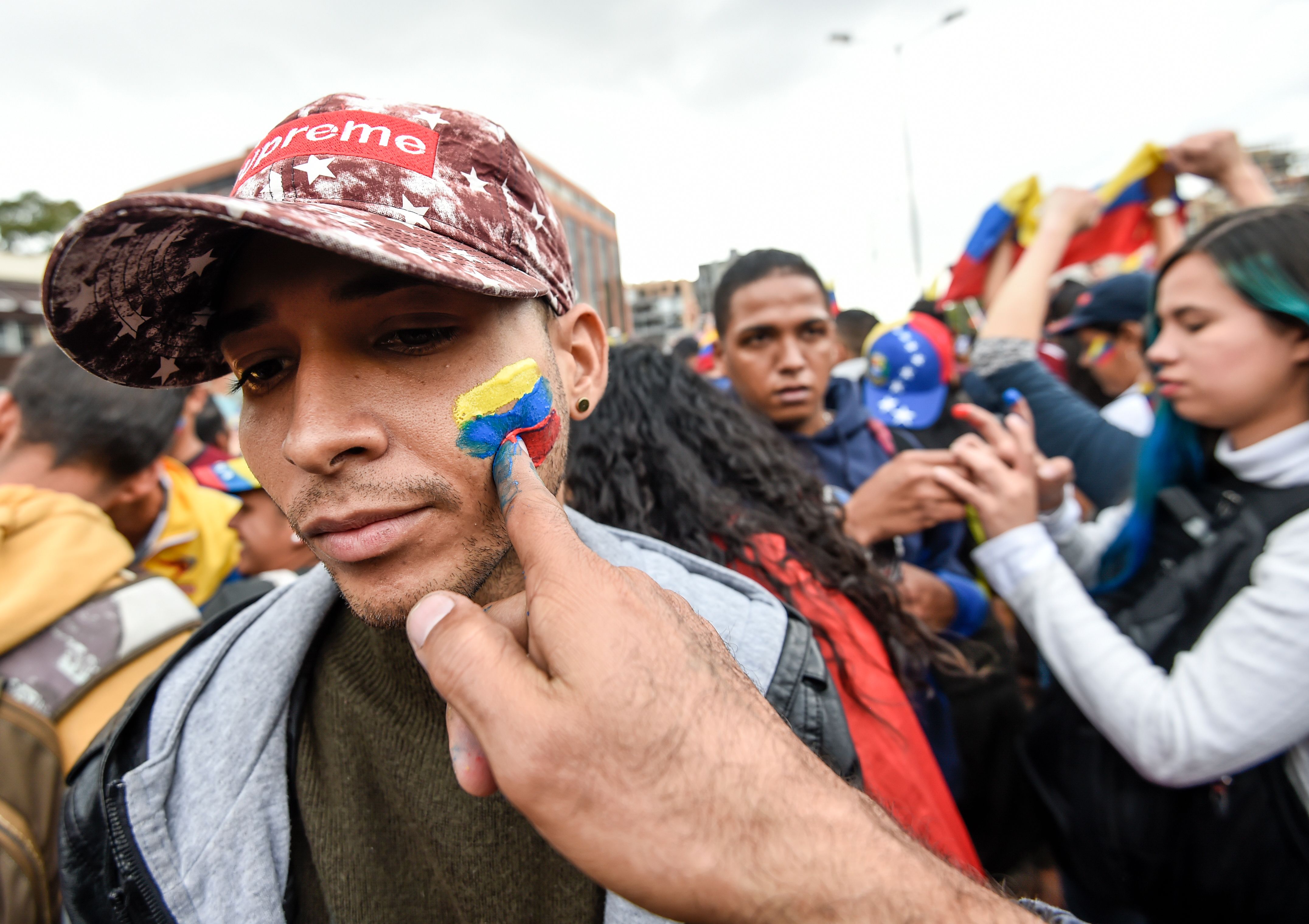 Venezuelans opposed to President Nicolas Maduro hold a demonstration in Bogota, Colombia in support of opposition leader Juan Guaido's self-proclamation as acting president of Venezuela, on January 23, 2019. (Photo by Juan BARRETO / AFP) (Photo credit should read JUAN BARRETO/AFP/Getty Images)