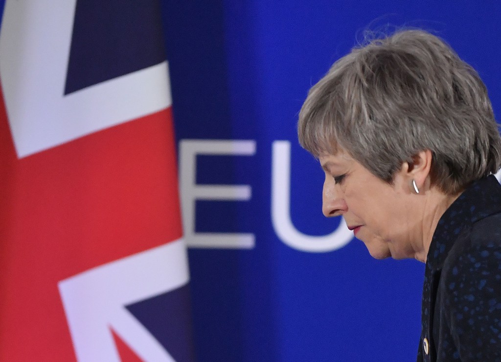 British Prime Minister Theresa May walks after holding a press conference on March 22, 2019, on the first day of an EU summit focused on Brexit, in Brussels. - European Union leaders meet in Brussels on March 21 and 22, for the last EU summit before Britain's scheduled exit of the union. (Photo by Emmanuel DUNAND / AFP) (Photo credit should read EMMANUEL DUNAND/AFP/Getty Images)