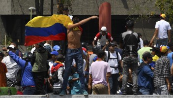 Supporters of Venezuelan opposition leader and self-proclaimed acting president Juan Guaido take part in a demonstration in Caracas on March 9, 2019. - Riot police blocked protesters as thousands of people took to the streets Saturday with tensions rising between opposition leader Juan Guaido and President Nicolas Maduro after crisis-wracked Venezuela emerged from the chaos of an electricity blackout. (Photo by YURI CORTEZ / AFP) (Photo credit should read YURI CORTEZ/AFP/Getty Images)