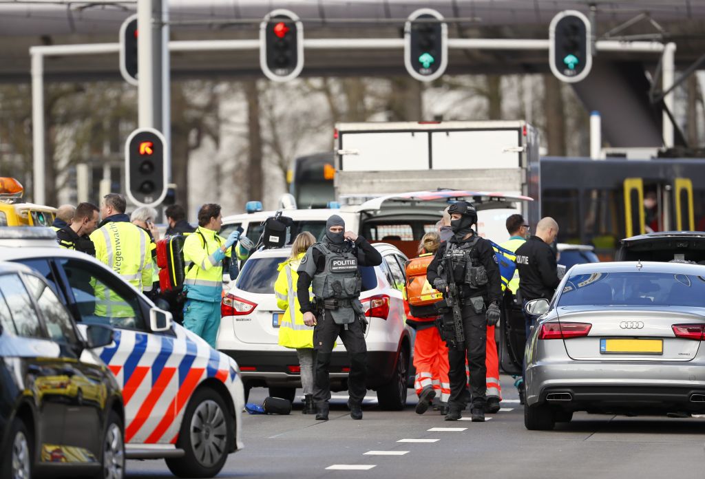 TOPSHOT - Police forces stand at the 24 Oktoberplace in Utrecht, on March 18, 2019 where a shooting took place. - Several people were wounded in a shooting on a tram in the Dutch city of Utrecht on March 18, police said, with local media reporting counter-terrorism police at the scene. "Shooting incident... Several injured people reported. Assistance started," the Utrecht police Twitter account said. "It is a shooting incident in a tram. Several trauma helicopters have been deployed to provide help." (Photo by Robin van Lonkhuijsen / ANP / AFP) / Netherlands OUT (Photo credit should read ROBIN VAN LONKHUIJSEN/AFP/Getty Images)