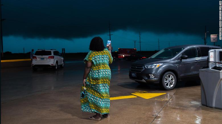 Tina Michael 30, films a tornado headed for Perry, Oklahoma from a gas station off of I-35.