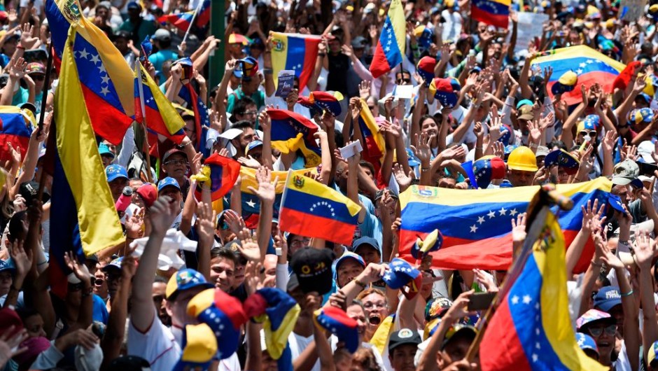 Anti-government demonstrators rally in Caracas to commemorate May Day on May 1, 2019 after a day of violent clashes on the streets of the capital spurred by Venezuelan opposition leader Juan Guaido's call on the military to rise up against President Nicolas Maduro. - Guaido called for a massive May Day protest to increase the pressure on President Maduro. (Photo by Federico PARRA / AFP) (Photo credit should read FEDERICO PARRA/AFP/Getty Images)