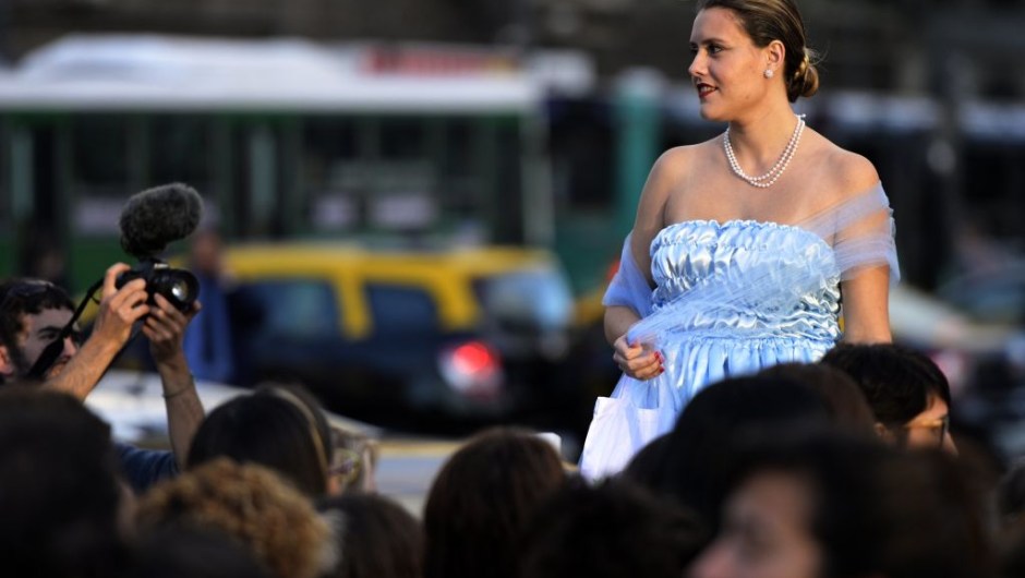 A woman fancy dressed as former Argentina's First Lady (1946-1952) Eva Peron (1919-1952), poses at the Republic square during a demonstration in Buenos Aires on May 6, 2019. - May 7th marks the 100th anniversary of Eva Duarte de Peron's (Evita) birth, who was called the "standard-bearer of the humble". (Photo by JUAN MABROMATA / AFP) (Photo credit should read JUAN MABROMATA/AFP/Getty Images)