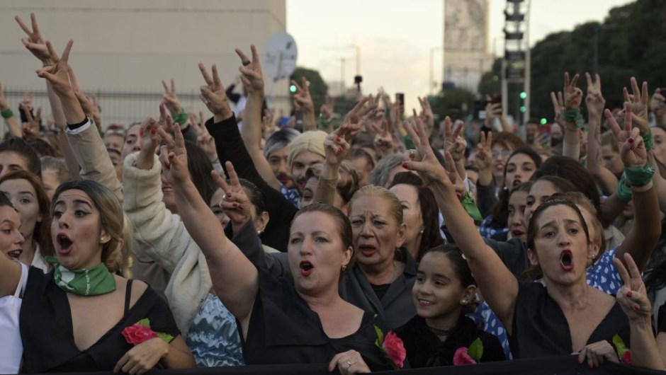 Women fancy dressed as former Argentina's First Lady (1946-1952) Eva Peron (1919-1952), shout slogans at the Republic square during a demonstration in Buenos Aires on May 6, 2019. - May 7th marks the 100th anniversary of Eva Duarte de Peron's (Evita) birth, who was called the "standard-bearer of the humble". (Photo by JUAN MABROMATA / AFP) (Photo credit should read JUAN MABROMATA/AFP/Getty Images)