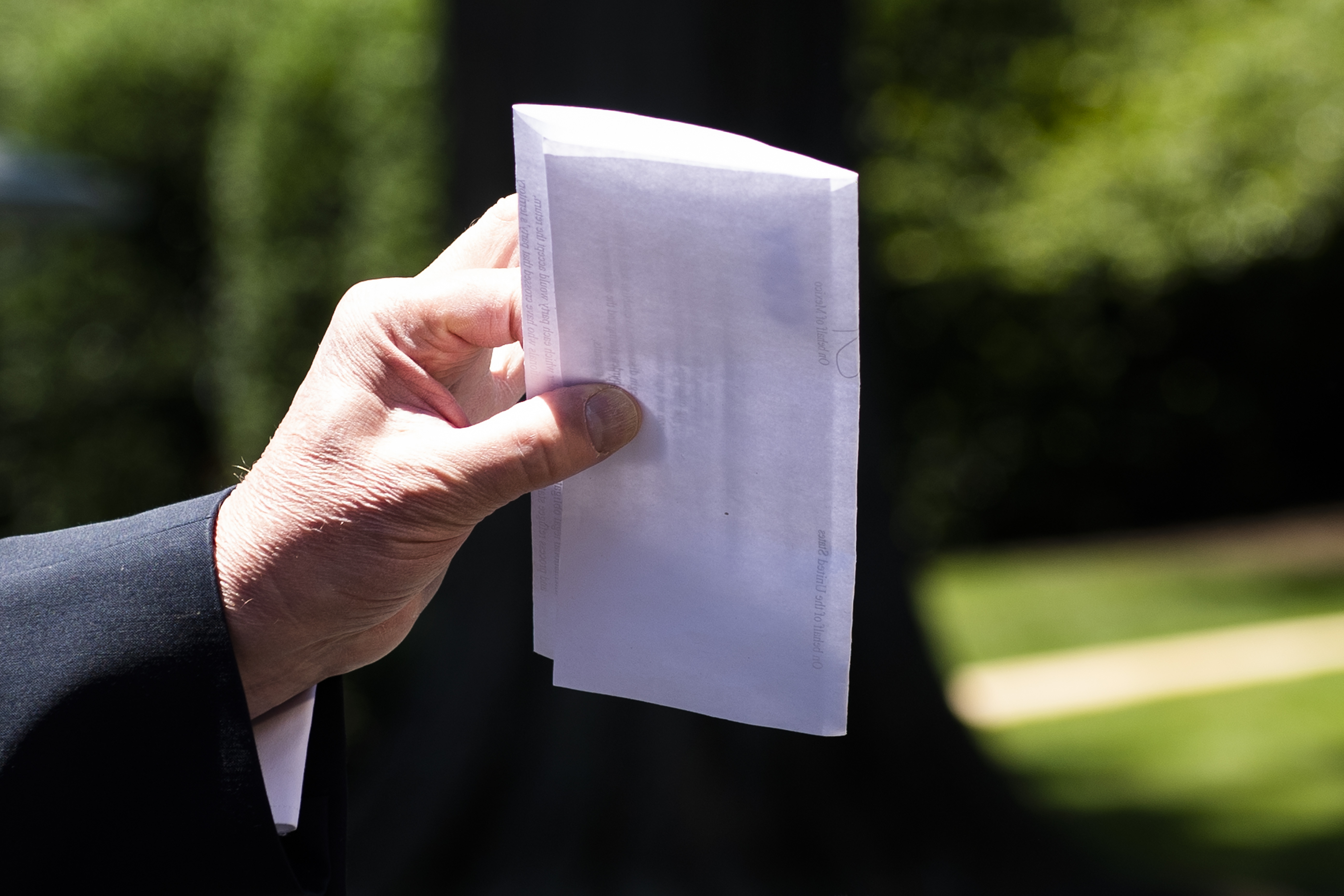 US President Donald Trump holds piece of paper saying its his deal with Mexico as he speaks with reporters at the White House, in Washington, DC, on June 11, 2019. - Trump did not show the paper to reporters. (Photo by Jim WATSON / AFP) (Photo credit should read JIM WATSON/AFP/Getty Images)