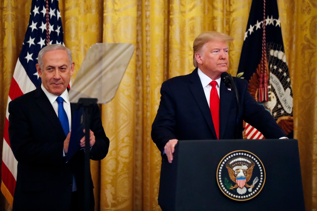 President Donald Trump and Israeli Prime Minister Benjamin Netanyahu arrive for a ceremony in the East Room of the White House, Tuesday, Jan. 28, 2020, in Washington. (AP Photo/Alex Brandon)