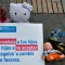 Toys are displayed next to a sign reading "Teach your children not to accept presents in exchange of favours" at the Bolivar square in Bogota, on November 20, 2019, as part of a campaign to raise awareness against child abuse during the universal Children's Day. - World Children's Day was first established in 1954 and is celebrated on November 20th to promote international awareness among children worldwide and improving their welfare. (Photo by Raul ARBOLEDA / AFP) (Photo by RAUL ARBOLEDA/AFP via Getty Images)
