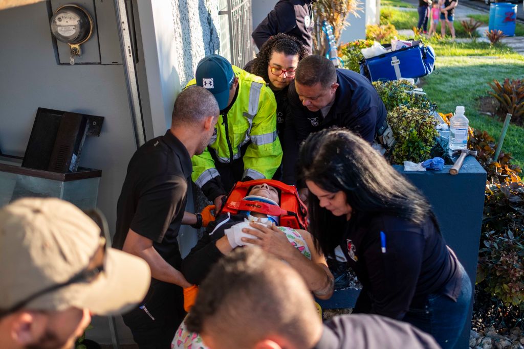 Paramedics carry away a patient on a stretcher that was injured after a earthquake hit the island in Ponce, Puerto Rico on January 7, 2020. - A strong earthquake struck south of Puerto Rico early January 7, 2020 followed by major aftershocks, the US Geological Survey said, the latest in a series of tremors that have shaken the island since December 28. The shallow 6.4 magnitude quake struck five miles (eight kilometers) south of the community of Indios, the USGS said, revising down its initial reading of 6.6. (Photo by Ricardo ARDUENGO / AFP) (Photo by RICARDO ARDUENGO/AFP via Getty Images)