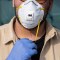 CASALPUSTERLENGO, ITALY - FEBRUARY 23: A man wearinig a respiratory mask and gloves is pictured on February 23, 2020 in Casalpusterlengo, south-west Milan, Italy. Casalpusterlengo is one of the ten small towns placed under lockdown earlier this morning as a second death from coronavirus sparked fears throughout the Lombardy region. (Photo by Emanuele Cremaschi/Getty Images)