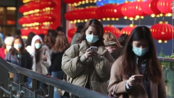 People wear face masks and walk at a shopping mall in Taipei, Taiwan, Friday, Jan. 31, 2020. People wear face masks as they walk through a shopping mall in Taipei, Taiwan, Friday, Jan. 31, 2020. According to the Taiwan Centers of Disease Control (CDC) Friday, the tenth case diagnosed with the new coronavirus has been confirmed in Taiwan. (AP Photo/Chiang Ying-ying)