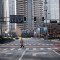 BEIJING, CHINA - FEBRUARY 03: A pedestrian crosses an empty street at a usually busy intersection in the Central Business District on February 3, 2020 in Beijing, China. China's stock markets tumbled in trading on Monday, the first day back after an extended Lunar New Year holiday as a mystery virus continues to spread in China and worldwide. The number of cases of a deadly new coronavirus rose to more than 17000 in mainland China Monday, days after the World Health Organization (WHO) declared the outbreak a global public health emergency. China continued to lock down the city of Wuhan in an effort to contain the spread of the pneumonia-like disease which medical experts have confirmed can be passed from human to human. In an unprecedented move, Chinese authorities have put travel restrictions on the city which is the epicentre of the virus and neighbouring municipalities, affecting tens of millions of people. The number of those who have died from the virus in China climbed to over 350 on Monday, mostly in Hubei province, and cases have been reported in other countries including the United States, Canada, Australia, Japan, South Korea, India, the United Kingdom, Germany, France and several others. The World Health Organization has warned all governments to be on alert and screening has been stepped up at airports around the world. (Photo by Kevin Frayer/Getty Images)
