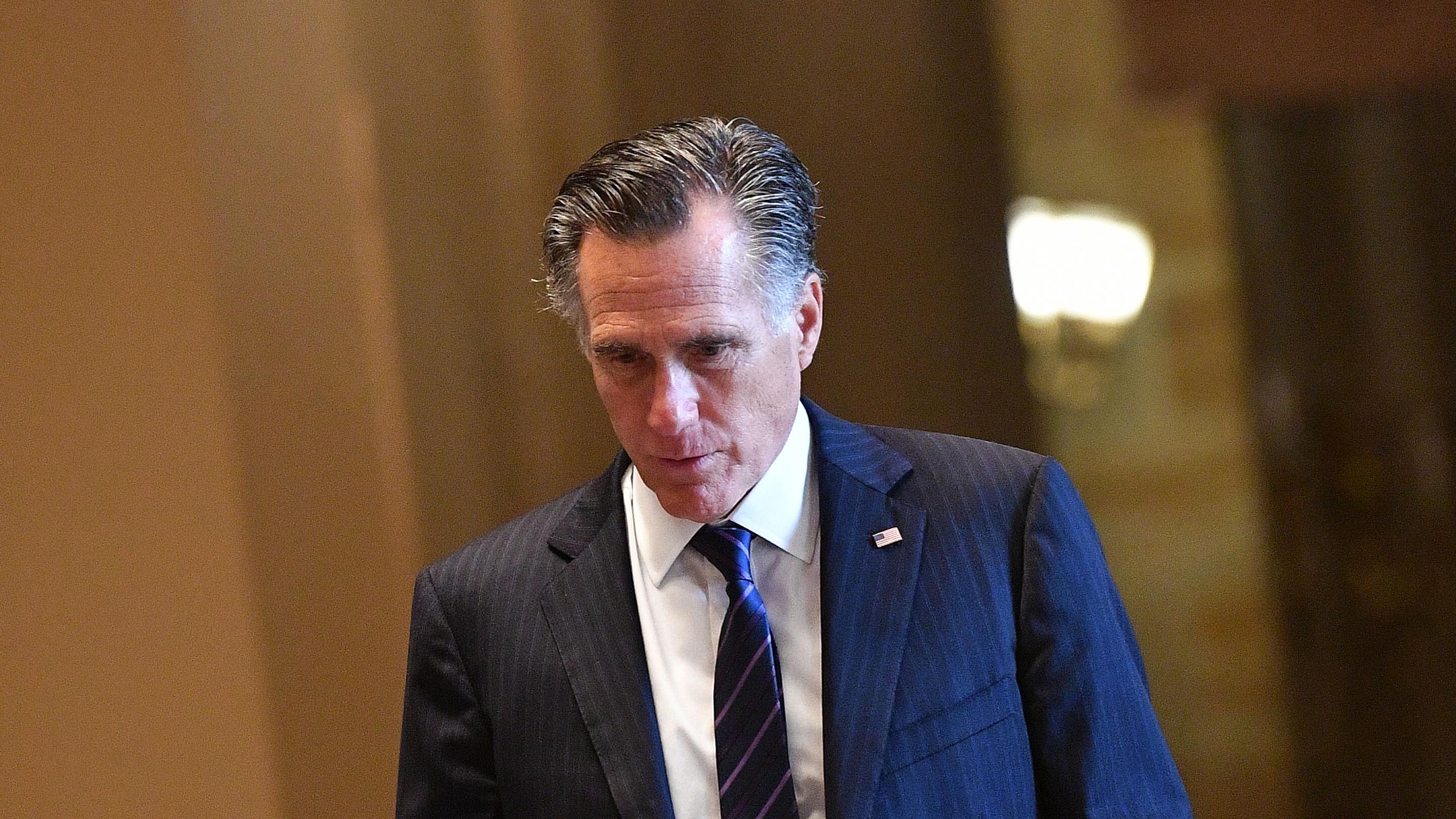 US Senator Mitt Romney (R-UT) returns from a recess during the impeachment trial proceedings of US President Donald Trump on Capitol Hill January 30, 2020, in Washington, DC. - The fight over calling witnesses to testify in President Donald Trump's impeachment trial intensified January 28, 2020 after Trump's lawyers closed their defense calling the abuse of power charges against him politically motivated. Democrats sought to have the Senate subpoena former White House national security advisor John Bolton to provide evidence after leaks from his forthcoming book suggested he could supply damning evidence against Trump. . (Photo by Mandel NGAN / AFP) (Photo by MANDEL NGAN/AFP via Getty Images)