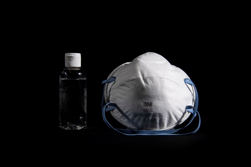 A picture taken on March 4, 2020, in Paris, shows a bottle of alcohol gel hand sanitiser and an FFP2 protective face mask. - Sales of face masks and hand sanitiser have risen and shortages are occuring in countries affected by the spread of COVID-19, the new coronavirus. (Photo by Olivier MORIN / AFP) (Photo by OLIVIER MORIN/AFP via Getty Images)