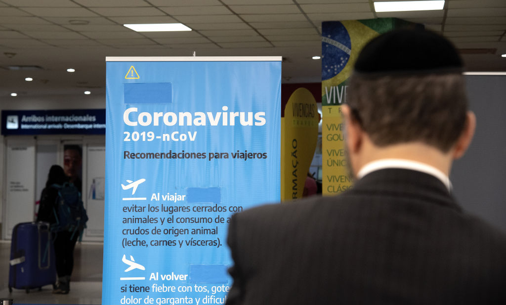 EZEIZA, ARGENTINA - MARCH 13: A banner with precautionary meassures is seen at Ministro Pistarini International Airport on March 13, 2020 in Ezeiza, Argentina. President of Argentina Alberto Fernandez signed a decree to ban travel from areas affected by COVID-19 outbreak. (Photo by Lalo Yasky/Getty Images)